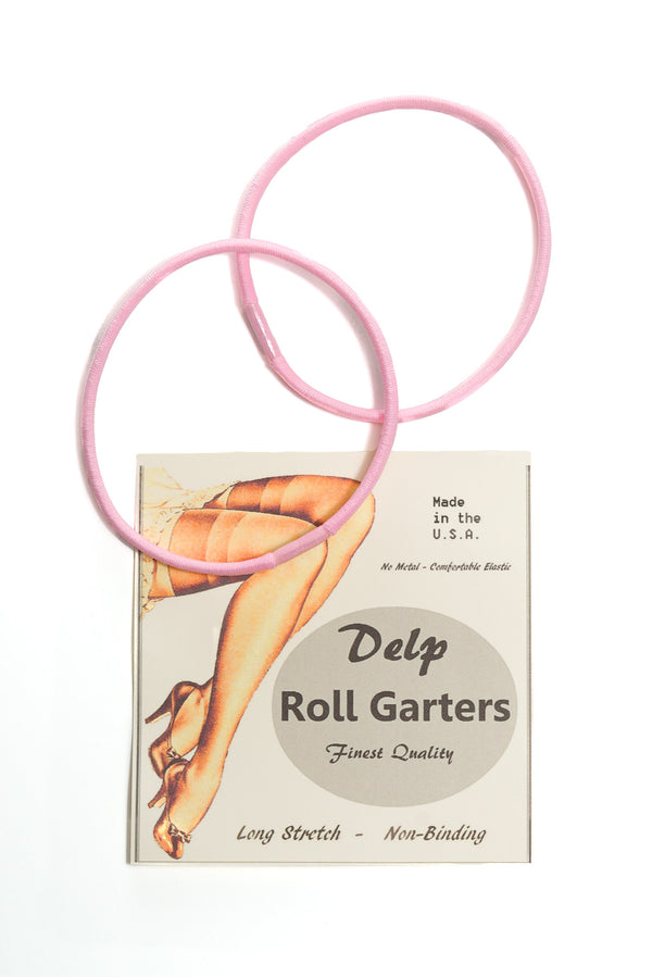 Delp Stockings, Roll Garters. Two pink elastic roll garters with retail packaging.