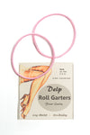 Delp Stockings, Roll Garters. Two pink elastic roll garters with retail packaging.